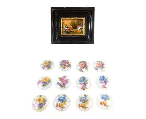 A Limoges porcelain panelled picture and a group of porcelain flower brooch plaques, the painting depicting cottage by river 
