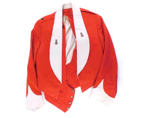 An Army Officer's mess jacket and waistcoat, with various buttons set with lion, crown and rose.