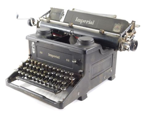 A vintage Imperial typewriter, number 55 ink black with chrome mounts, 50cm wide.