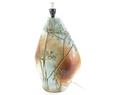 A 20thC studio Tremaen pottery Newlyn lamp, decorated with clock dandelions, in orange and blue, with modern electrical featu