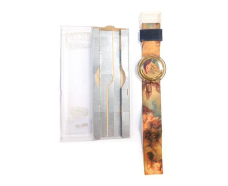 A Swatch Hop Puti watch, designed by Vivienne Westwood with a cherub design, clear Perspex central dial on velvet strap, boxe