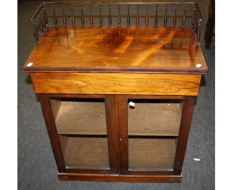 A 19th century rosewood chiffonier, the spindle turned gallery rail upstand over a frieze drawer and pair of glazed doors enc