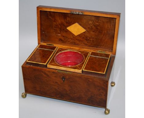 A 19th century burr yew and boxwood strung tea caddy of rectangular form, with twin lidded cannisters and period glass mixing