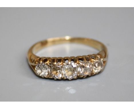An 18ct five stone diamond Ring, claw set five graduated old cushion-cut diamonds, estimated total diamond weight 1.00ct, sta