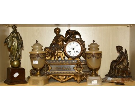 A 19th century French ormolu mantle clock with seated frame and eagle surmount (at fault) together with a pair of unassociate