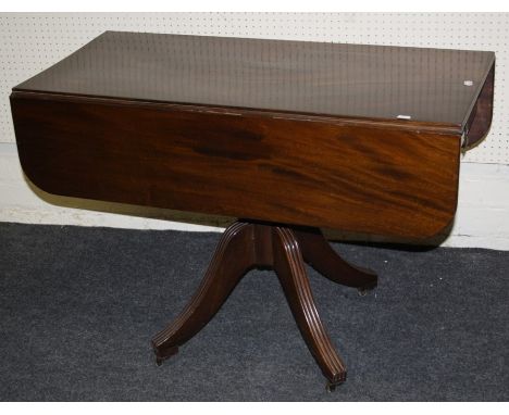 A Geo IV mahogany, pillar Pembroke table with  single frieze drawer. Raised on four reeded sabre supports. 90cm wide