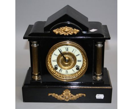 A late 19th century cast metal architectural cased mantle clock, the American eight day gong striking movement faced by Ivori