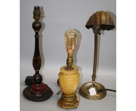 A 1930's brass desk lamp with scallop shade, an alabaster table lamp and an early 20th century black lacquer table lamp (3)