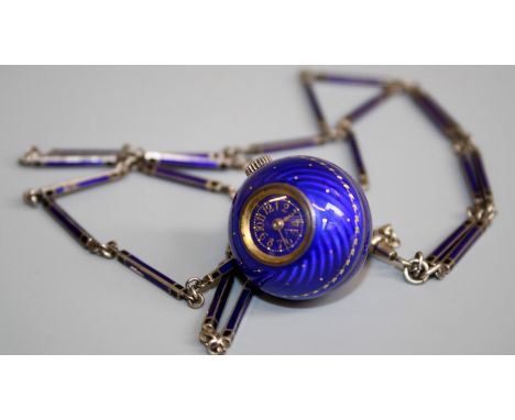 A Continental blue enamel ball Fob Watch, having Arabic numerals, the guilloche royal blue case with gilt running leafage bor