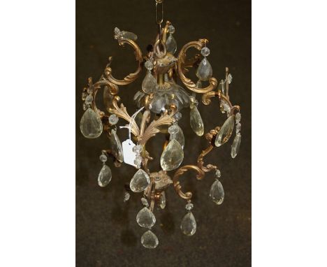 An early 20th century bird cage Rococo form gilt metal hanging ceiling light with facet lustre drops. 40cm