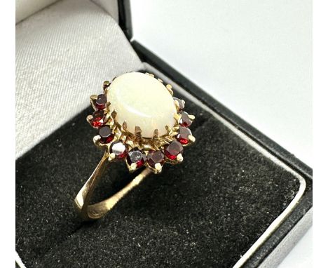 9ct gold opal &amp; garnet ring opal measures approx 11mm by 8mm  weight 3.9g 