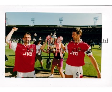 TONY ADAMS      Twenty two colour photos of action for Arsenal and England in the 1990's, mostly 10" X 7".    Good