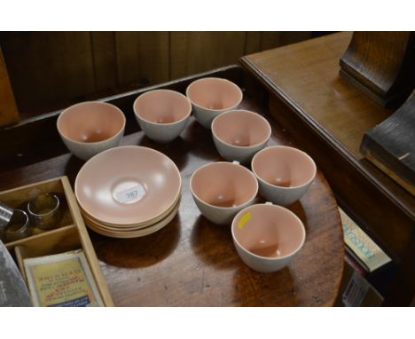A quantity of Poole twin tone tea cups and saucers 