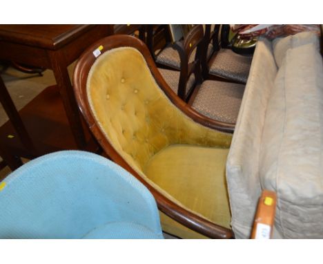 A Victorian mahogany button back armchair