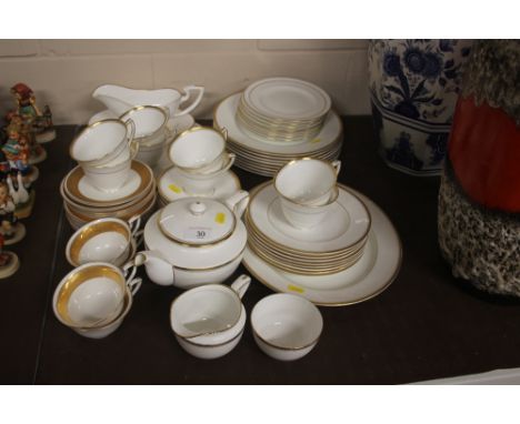 A quantity of Royal Worcester white glazed and gilt decorated tea and dinnerware