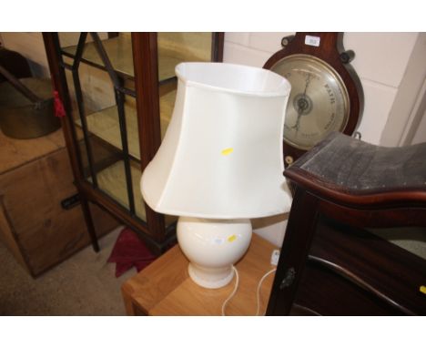 A white glazed table lamp with shade