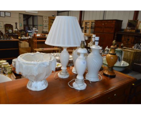 A quantity of table lamp bases with shades 