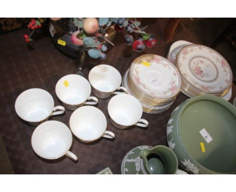 A quantity of Royal Doulton Canton tea cups, saucers, and side plates