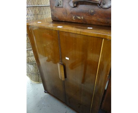 A vintage polished cocktail cabinet with period interior wallpaper and glass interior, 98cms high x 73cms wide x 87cms deep C