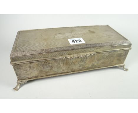 Silver cigarette three-section box raised on four scroll feet 'Presented to Mr A  A Dean by the Management &amp; Staff of Lan