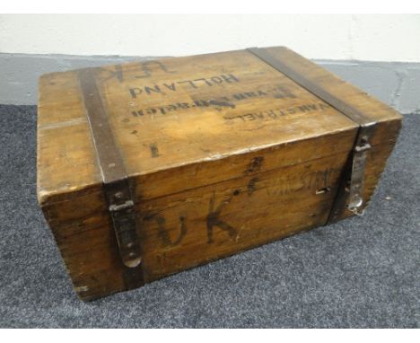 A vintage pine travel trunk with metal mounted banding and iron handles complete with former owner's handwritten Dutch name a