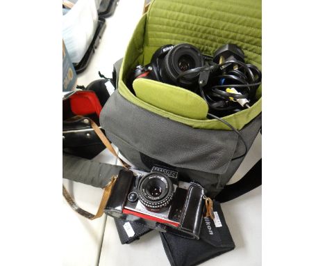 A cased vintage Praktica Super TL camera and later camera equipment Condition reports provided on request by email for this a