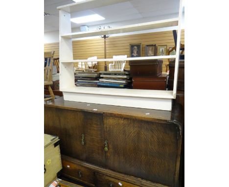 A vintage oak sideboard having two cupboards and two drawers together with an open bookcase Condition reports provided on req
