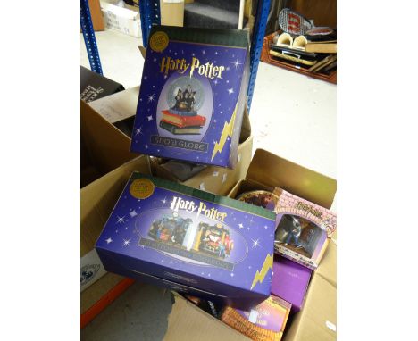 Collection of Harry Potter memorabilia including Harry Potter snow globe, desk clock, 9 3/4 bookends, trivia game, Diagon All