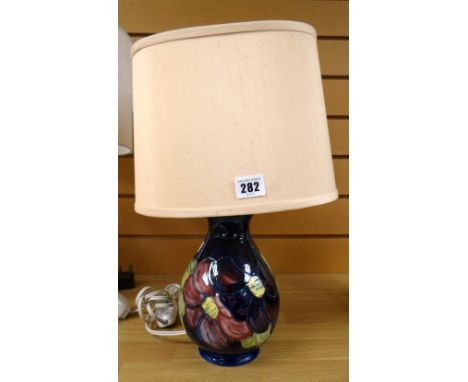 A blue ground Moorcroft floral table lamp &amp; shade Condition reports provided on request by email for this auction otherwi