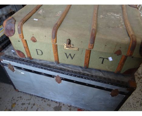 A canvas covered and wooden banded cabin trunk and a mid-century vintage cargo case Condition reports provided on request by 