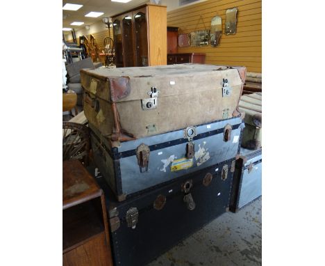 Two mid-century hard lined cabin cargo trunks &amp; an earlier canvas lined vintage cabin trunk Condition reports provided on