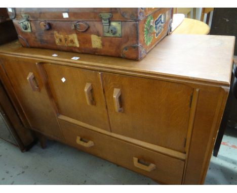 A vintage / mid-century oak sideboard unit having a combination of single drawer and cupboards Condition reports provided on 