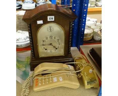 An early twentieth century German-type chiming mantel clock with arched glass covered silvered dial bearing Arabic numeral ch
