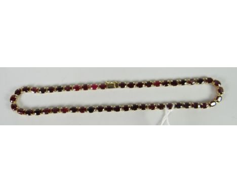 A ruby line necklace with full jewellers assessment paperwork (please see image) Condition reports provided on request by ema