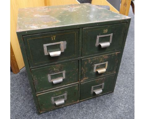 A vintage painted metal six-drawer filing chest with mounted white metal index holders and gilded numbering to each drawer, 5