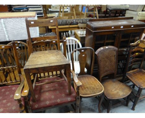 A parcel of mixed chairs including three hoop-back kitchen chairs and a two-door glazed vintage bookcase ETC Condition report