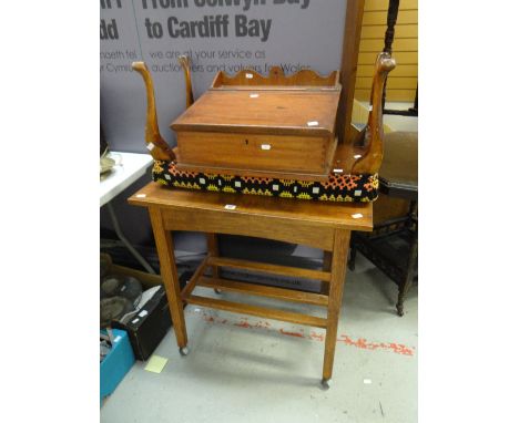 A vintage sloped and galleried writing box, a long stool covered in a section of traditional Welsh geometric patterned wool b