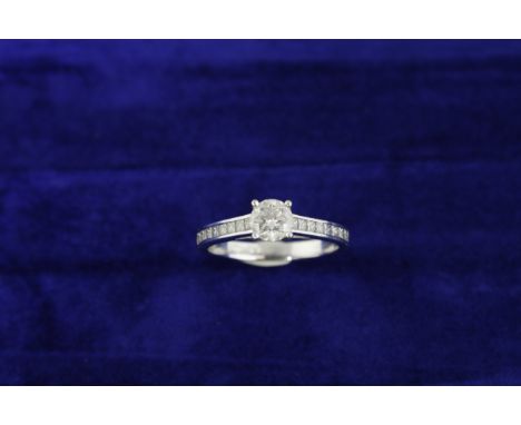 A GIA certificated diamond ring, the central round brilliant cut diamond approx 0.53ct, colour D, clarity VS2, with diamond s
