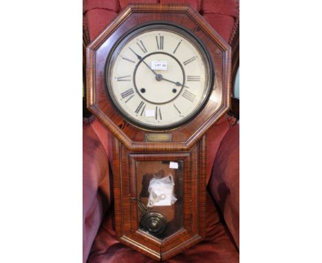 A first quarter 20th century drop dial wall clock by Seikosha Tokyo in exotic wooden case with brass plaque, Presented by the