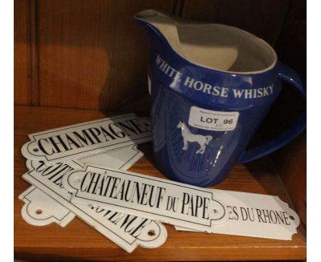 A Wade White Horse Whisky jug with five enamel drinks labels
