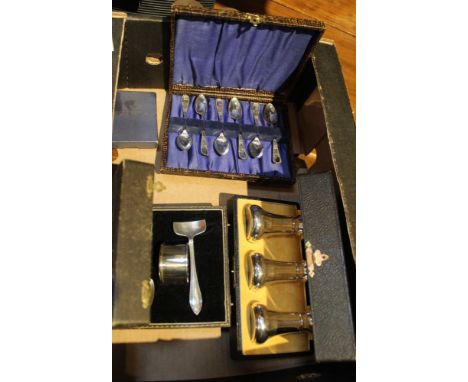 A cased silver christening set, complete with napkin ring, a cased set of three silver condiments, a silver cased ladies pock