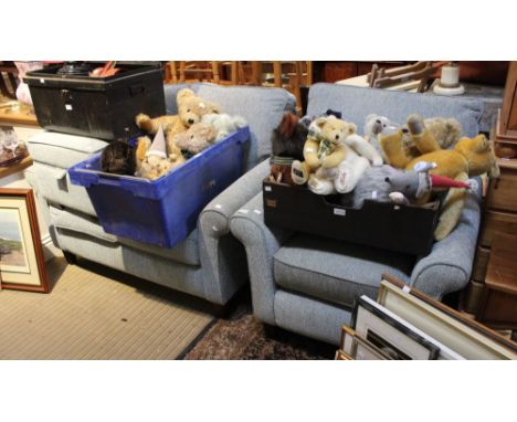 A modern light blue upholstered two seater sofa with armchair and foot stool