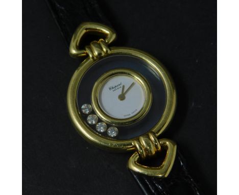 An 18ct yellow gold Chopard 'Happy Diamonds' ladies watch, with 4 diamonds, set on leather strap 