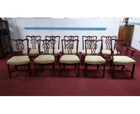 A set of 10 Chippendale style mahogany dining chairs to include 2 carvers, by Frank Hudson &amp; sons for Harrods 