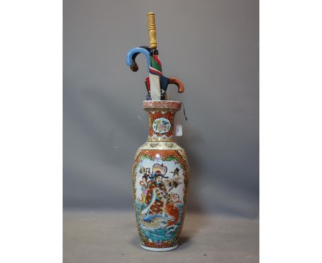 A large Japanese vase, decorated with figures, animals and flowers, to inlude a walking stick and umbrellas H.62cm 