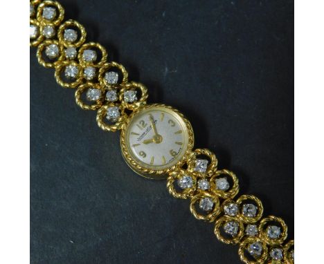 An 18ct yellow gold Jaeger LeCoultre ladies watch, set with 20 diamonds, back winder is loose 