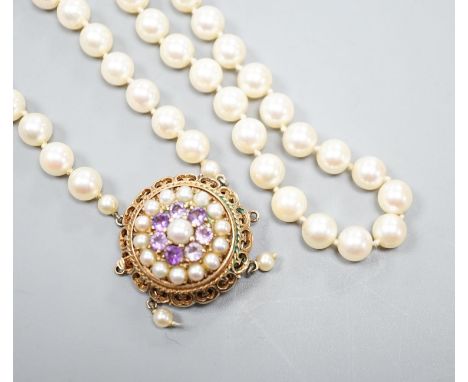 A 1960's double strand cultured pearl necklace, with 9ct gold, amethyst and cultured pearl set clasp (a.f.), approx. 40cm,str