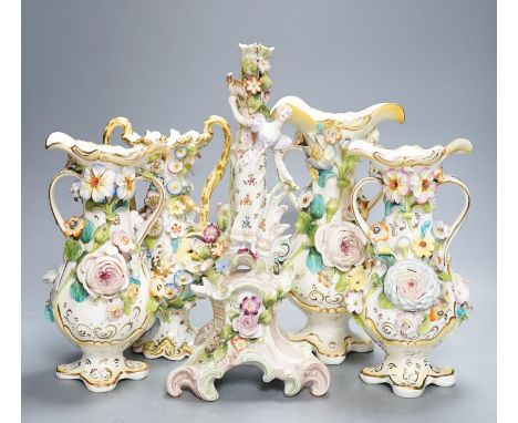 Four Coalport-type floral encrusted vases and a figural candlestick, 32cm