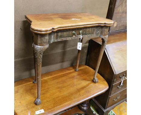 A George II mahogany folding card table on carved cabriole legs, width 76cm, depth 38cm, height 72cm