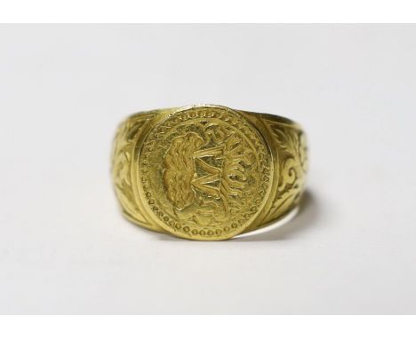 A late 16th/early 17th century yellow metal signet/seal ring, engraved with the initials SMU, the M formed as the trunk of an